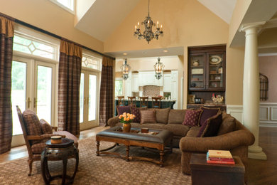 Mid-sized trendy medium tone wood floor and brown floor living room photo in Philadelphia with beige walls