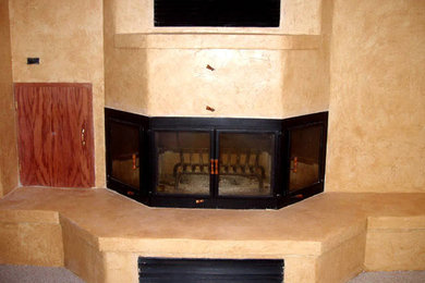 Example of a mid-sized classic carpeted living room design in Denver with beige walls, a standard fireplace and a metal fireplace