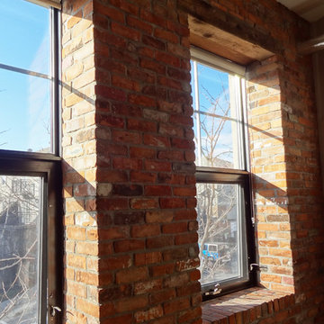Interior reclaimed brick with barn beam lintels.