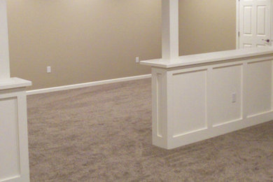 Example of a carpeted living room design in Philadelphia with beige walls