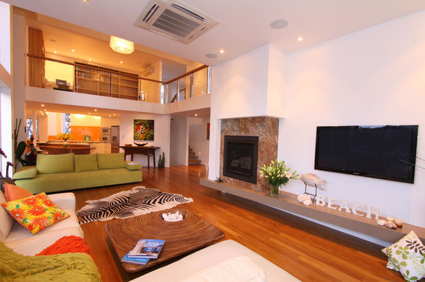 Tropical Living Room by Skale Building Design