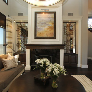 Example of a classic dark wood floor living room design in San Diego with a standard fireplace