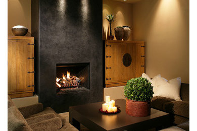 Example of a mid-sized trendy living room design in Los Angeles with beige walls, a standard fireplace and a stone fireplace