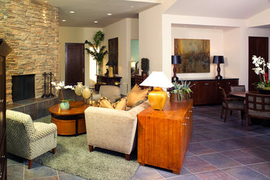 Example of a mid-sized trendy formal and open concept slate floor living room design in Los Angeles with white walls, a standard fireplace and a stone fireplace