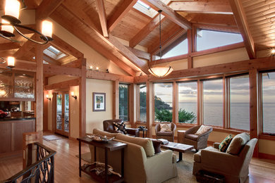 Example of a mountain style formal and open concept medium tone wood floor living room design in Seattle with beige walls, no fireplace and no tv