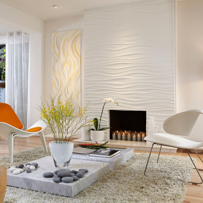 Inspiration for a mid-sized contemporary open concept light wood floor living room remodel in Miami with a standard fireplace and white walls