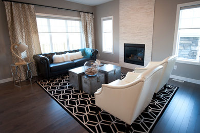 Photo of a medium sized beach style formal open plan living room in Edmonton with beige walls, dark hardwood flooring, a standard fireplace, a stone fireplace surround and no tv.