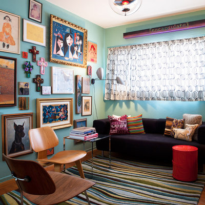 Example of an eclectic medium tone wood floor living room design in San Francisco with blue walls