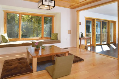 Living room - mid-sized formal and loft-style medium tone wood floor living room idea in DC Metro with white walls, no fireplace and no tv