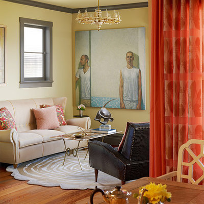 Living room - eclectic medium tone wood floor living room idea in San Francisco with yellow walls