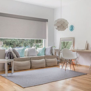 Photo of a large scandinavian formal open concept living room in Other with white walls, light hardwood floors, no tv and brown floor.