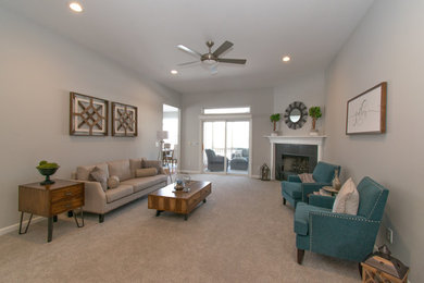 Large transitional open concept carpeted and gray floor living room photo in Cincinnati with gray walls, a standard fireplace and a tile fireplace