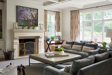 Transitional medium tone wood floor and brown floor living room photo in Atlanta with white walls and a standard fireplace