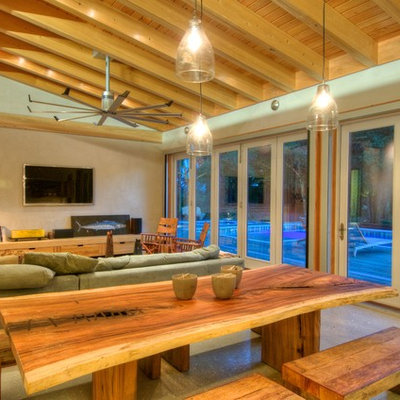 Living room - mid-sized cottage open concept concrete floor living room idea in Tampa with no fireplace and a wall-mounted tv
