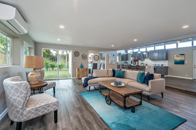 Transitional open concept dark wood floor and gray floor living room photo in Hawaii with beige walls