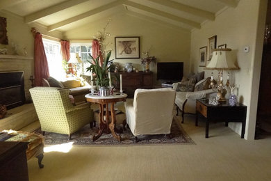 Mid-sized elegant formal and enclosed carpeted living room photo in San Francisco with white walls, a standard fireplace, a brick fireplace and a tv stand