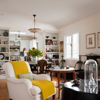Inspiration for an eclectic enclosed living room library remodel in Los Angeles with white walls