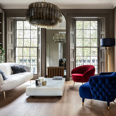 Inspiration for a large contemporary formal light wood floor living room remodel in London with a standard fireplace, no tv and brown walls