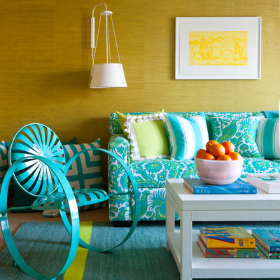 Example of an eclectic living room design in New York with yellow walls
