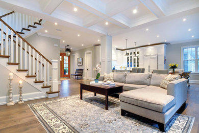 Large modern formal open plan living room in Toronto with grey walls, dark hardwood flooring and brown floors.