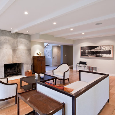 Living room - large contemporary formal and open concept light wood floor and brown floor living room idea in Vancouver with a standard fireplace, a concrete fireplace, beige walls and no tv