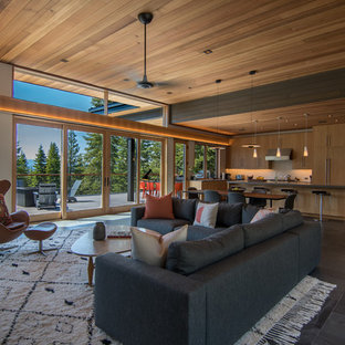 Example of a mid-sized 1950s open concept slate floor and orange floor living room design in Sacramento with white walls and no tv