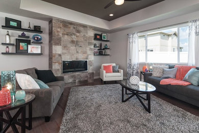 Trendy living room photo in Other with a standard fireplace and a tile fireplace