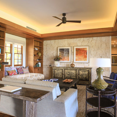 Living room - tropical open concept dark wood floor living room idea in Hawaii with beige walls