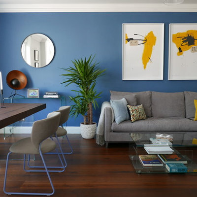 Living room - small contemporary open concept dark wood floor and brown floor living room idea in London with blue walls and no fireplace