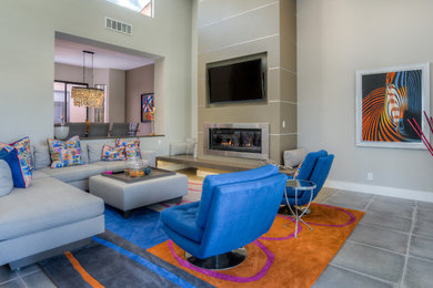 Example of a large trendy formal and open concept porcelain tile living room design in Seattle with gray walls, a standard fireplace, a plaster fireplace and a wall-mounted tv