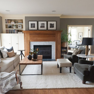 Living room - coastal brown floor living room idea in Minneapolis with gray walls and a tile fireplace