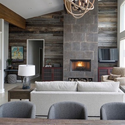 Example of a trendy open concept beige floor living room design in Chicago with gray walls, a standard fireplace, a tile fireplace and a wall-mounted tv