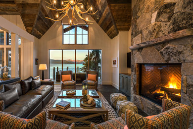 Mid-sized mountain style open concept dark wood floor and gray floor living room photo in Sacramento with white walls, a standard fireplace, a stone fireplace and a wall-mounted tv