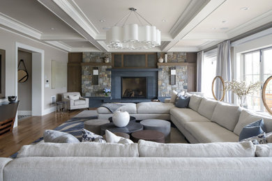 Inspiration for a mid-sized transitional formal and enclosed medium tone wood floor and brown floor living room remodel in New York with a standard fireplace, no tv and beige walls