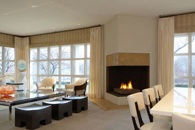 Exemple d'un salon tendance de taille moyenne et ouvert avec une salle de réception, un mur blanc, moquette, une cheminée d'angle, un manteau de cheminée en carrelage, aucun téléviseur et un sol gris.