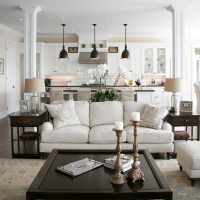 Mid-sized elegant open concept and formal dark wood floor and brown floor living room photo in Toronto with white walls, a standard fireplace, a stone fireplace and a wall-mounted tv