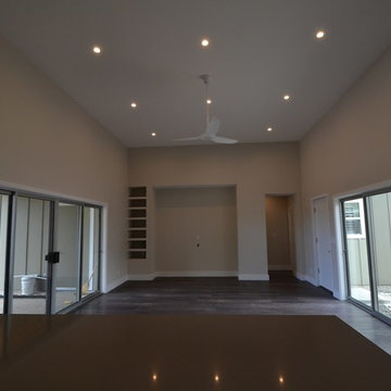 Large living area with built in storage for media.