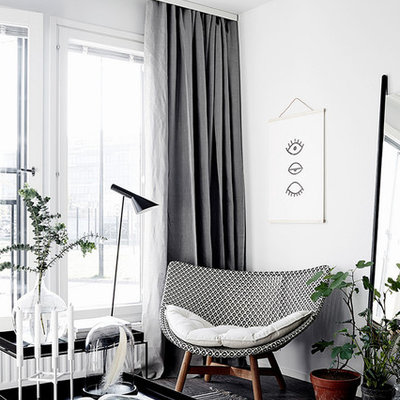 Inspiration for a scandinavian dark wood floor living room remodel in Other with white walls