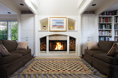 Inspiration for a large transitional enclosed dark wood floor and brown floor living room remodel in Seattle with white walls, a standard fireplace, a tile fireplace and no tv