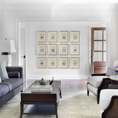 Example of a classic living room design in Atlanta with white walls