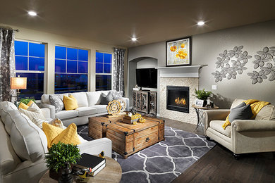 Large transitional open concept medium tone wood floor living room photo in Other with gray walls, a standard fireplace, a stone fireplace and a wall-mounted tv
