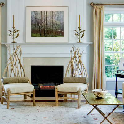 Inspiration for a huge contemporary enclosed medium tone wood floor living room remodel in Philadelphia with gray walls, a standard fireplace, a stone fireplace and no tv
