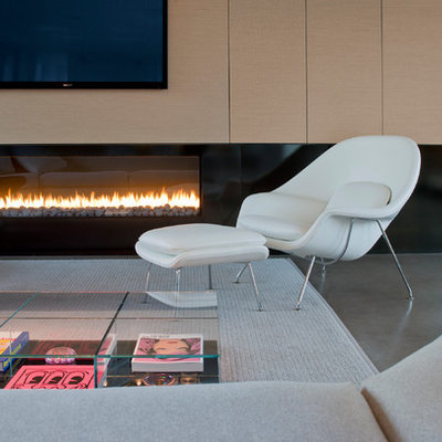 Minimalist open concept concrete floor living room photo in Phoenix with a ribbon fireplace and a wall-mounted tv