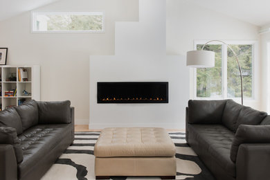 Example of a large trendy formal and open concept light wood floor and beige floor living room design in Boston with white walls, a ribbon fireplace, a metal fireplace and no tv