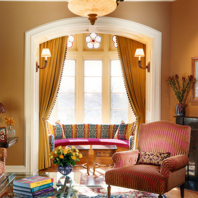 Elegant living room photo in New York with brown walls