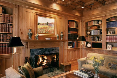 Living room library - traditional living room library idea in Raleigh with a standard fireplace