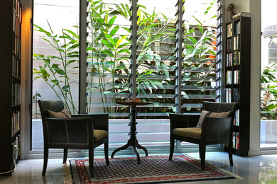 Example of an island style living room design in Brisbane
