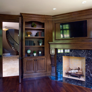 Library with Dark Stain Maple Cabinetry and Marble Surround Fireplace