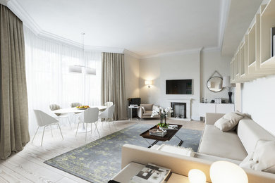 Esempio di un soggiorno design di medie dimensioni e aperto con pareti verdi, parquet chiaro e TV a parete