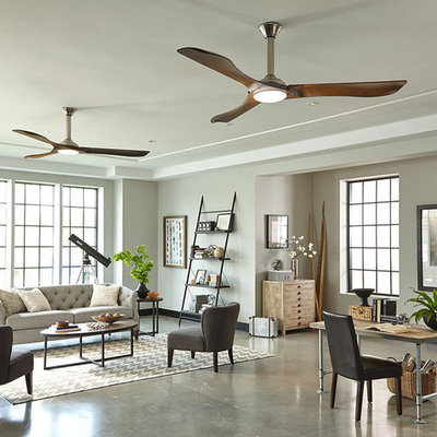 Example of a huge danish open concept concrete floor living room design in New York with gray walls and no fireplace
